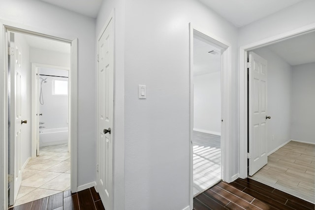 12318 Amado Dr, Houston, TX 77065 - corridor featuring wood finished floors and baseboards