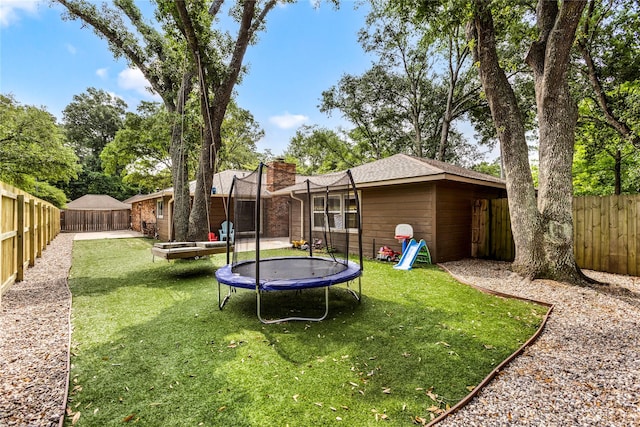 view of yard featuring a trampoline