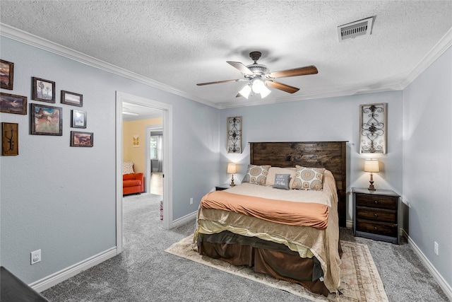 bedroom featuring carpet floors, ornamental molding, a textured ceiling, a ceiling fan, and baseboards
