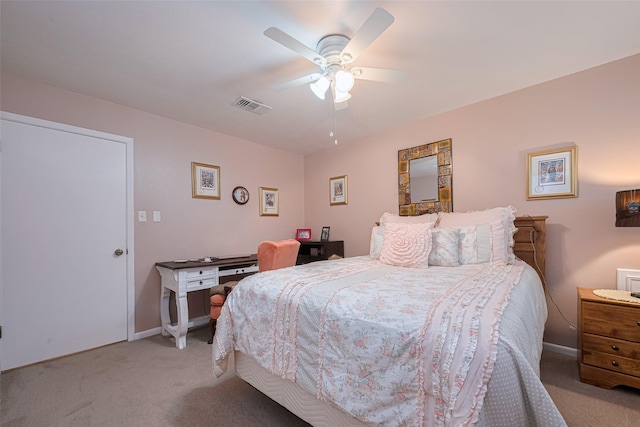 1745 15th St, Hempstead, TX 77445 - bedroom with light colored carpet, baseboards, and a ceiling fan