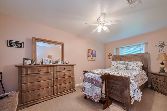 1745 15th St, Hempstead, TX 77445 - bedroom with light colored carpet, a ceiling fan, and baseboards