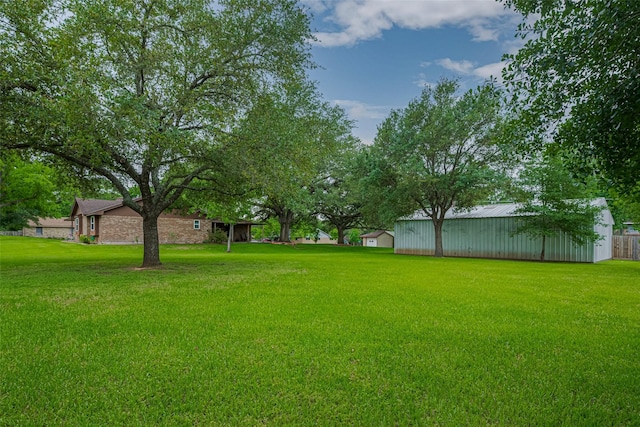 1745 15th St, Hempstead, TX 77445 - view of grassy yard with an outbuilding and an outdoor structure