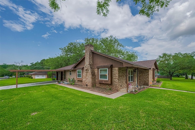 1745 15th St, Hempstead, TX 77445 - view of front of home with a chimney, brick siding, driveway, a front lawn, and a carport