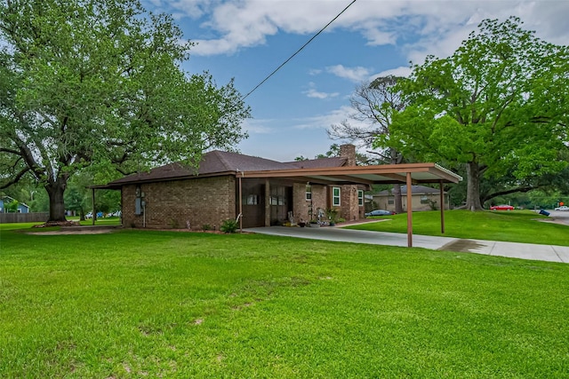 1745 15th St, Hempstead, TX 77445 - view of front facade featuring a front lawn, a chimney, and brick siding