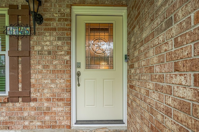 1745 15th St, Hempstead, TX 77445 - view of exterior entry featuring brick siding