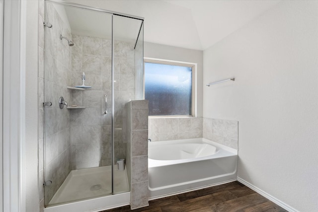 12225 Trumpetfish Dr, Conroe, TX 77304 - bathroom with wood finished floors, a stall shower, a bath, and baseboards