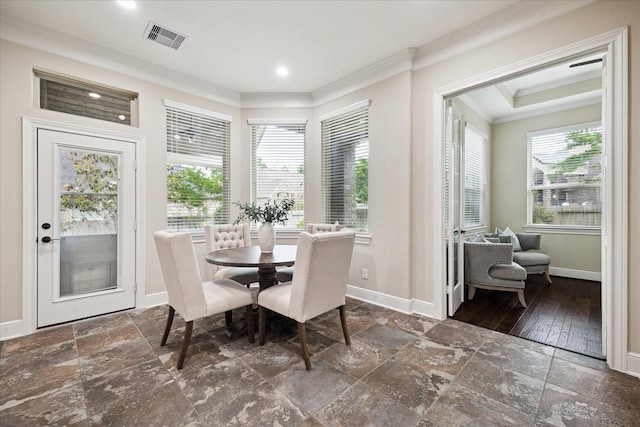 dining room with crown molding, baseboards, stone tile flooring, and recessed lighting