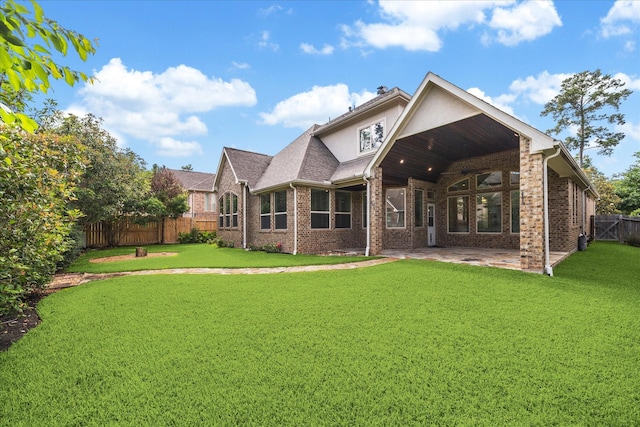 back of house featuring a patio and brick siding