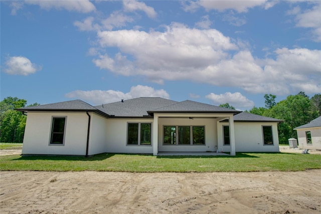 1156 Rd 6604, Dayton, TX 77535 - back of property featuring ceiling fan, a patio, a lawn, and stucco siding