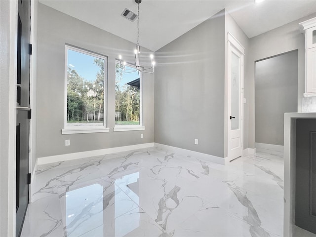 1156 Rd 6604, Dayton, TX 77535 - unfurnished dining area with baseboards, a chandelier, marble tiled flooring, plenty of natural light, and vaulted ceiling