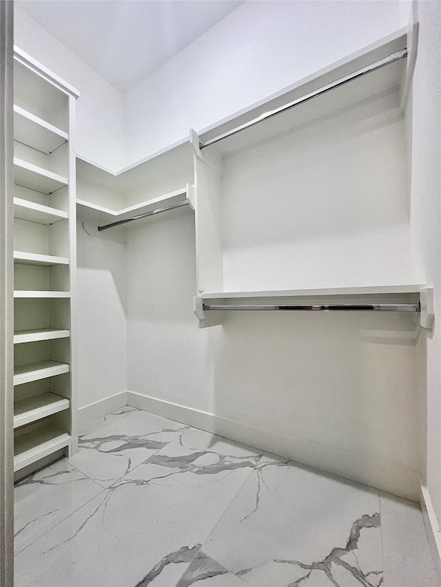 1156 Rd 6604, Dayton, TX 77535 - walk in closet with marble look tile flooring