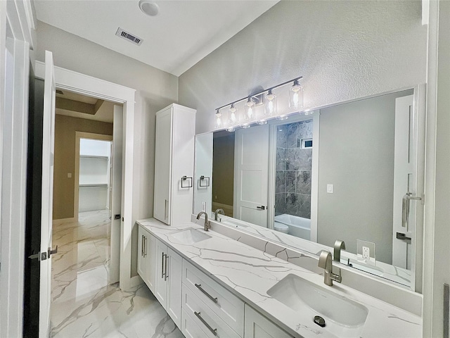 1156 Rd 6604, Dayton, TX 77535 - bathroom featuring marble look tiles, a tub, and double vanity