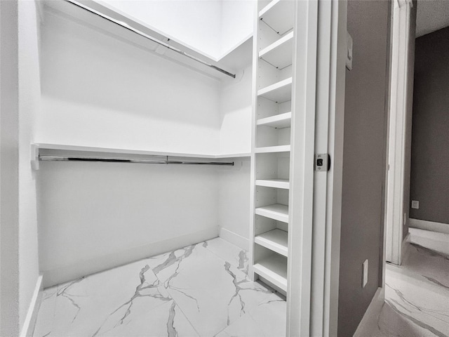 1156 Rd 6604, Dayton, TX 77535 - walk in closet featuring marble look tiles