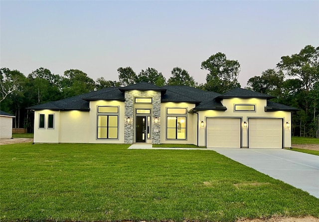 1156 Rd 6604, Dayton, TX 77535 - view of front of property with stone siding, a garage, driveway, a front lawn, and stucco siding