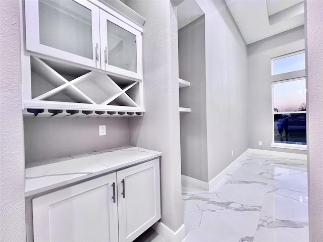 1156 Rd 6604, Dayton, TX 77535 - bar area featuring light marble finish flooring and baseboards