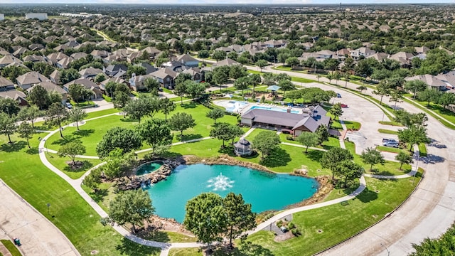 aerial perspective of suburban area featuring a pool area