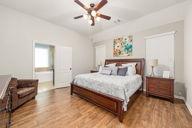 bedroom featuring wood finished floors, ceiling fan, and connected bathroom