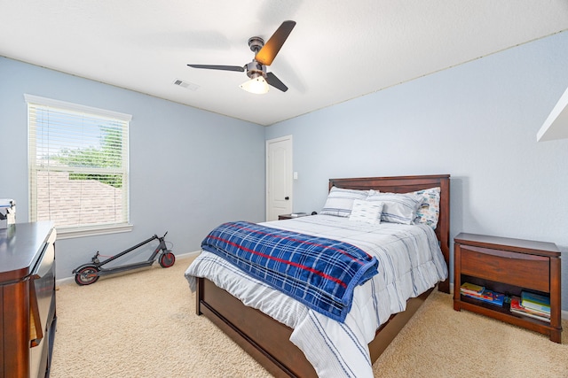 bedroom with carpet, ceiling fan, and baseboards