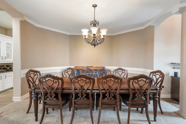 44 Logansport Ct, Montgomery, TX 77356 - dining area featuring a chandelier, crown molding, arched walkways, light carpet, and baseboards