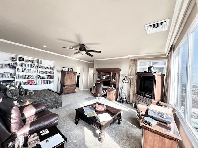 2016 Main St Unit Ph3, Houston, TX 77002 - carpeted living room featuring ceiling fan, plenty of natural light, ornamental molding, and baseboards