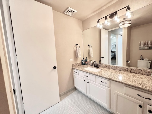 2016 Main St Unit Ph3, Houston, TX 77002 - bathroom with tile patterned floors, vanity, toilet, and baseboards