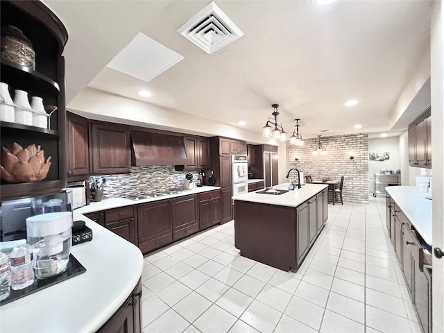 2016 Main St Unit Ph3, Houston, TX 77002 - kitchen with custom exhaust hood, light countertops, light tile patterned floors, open shelves, and recessed lighting