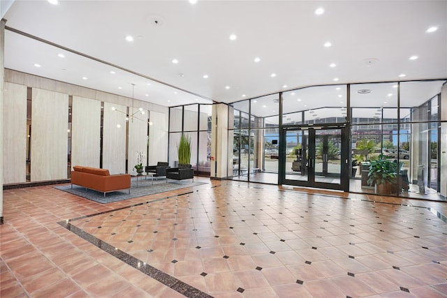 2016 Main St Unit Ph3, Houston, TX 77002 - community lobby with floor to ceiling windows, recessed lighting, and a high ceiling
