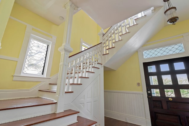 1827 Ball St, Galveston, TX 77550 - entrance foyer with stairs, wainscoting, plenty of natural light, and wood finished floors