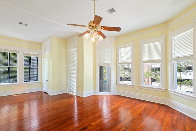 1827 Ball St, Galveston, TX 77550 - unfurnished living room with hardwood / wood-style floors, ceiling fan, healthy amount of natural light, and baseboards