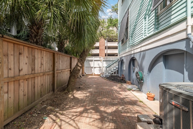 1827 Ball St, Galveston, TX 77550 - fenced backyard with central air condition unit and a patio area