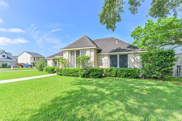 4734 Baywood Dr, Pasadena, TX 77505 - view of front of property featuring a front yard, brick siding, a shingled roof, and stone siding