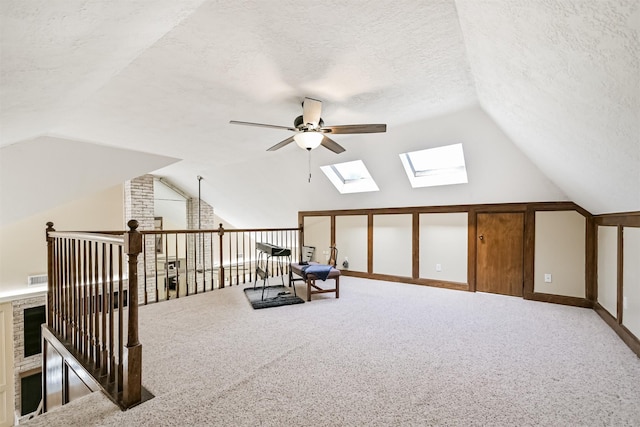 4734 Baywood Dr, Pasadena, TX 77505 - bonus room with a ceiling fan, lofted ceiling, a skylight, a textured ceiling, and carpet flooring