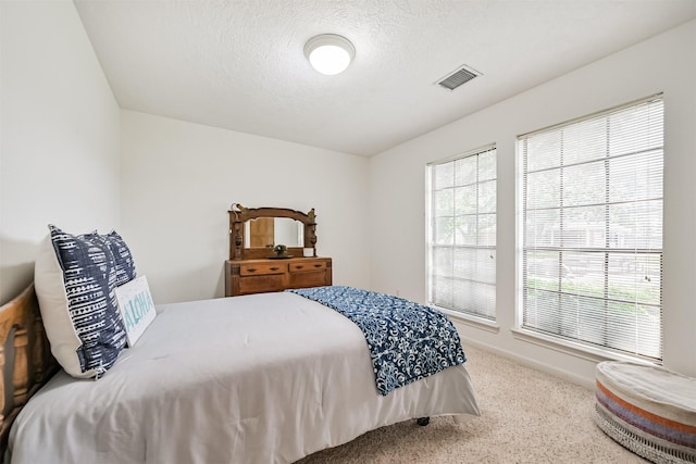 4734 Baywood Dr, Pasadena, TX 77505 - bedroom with carpet flooring, a textured ceiling, and baseboards
