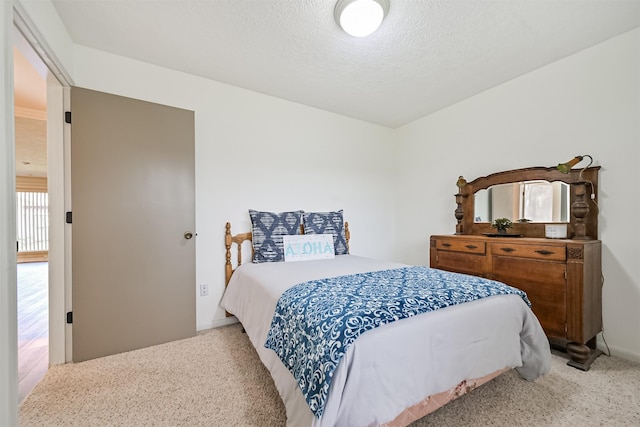 4734 Baywood Dr, Pasadena, TX 77505 - bedroom with light colored carpet, a textured ceiling, and baseboards