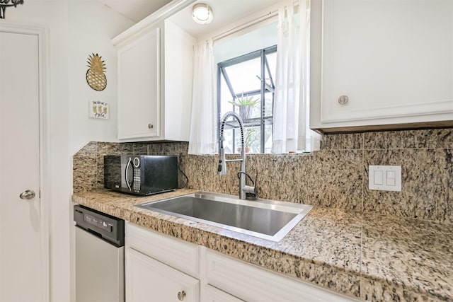 4734 Baywood Dr, Pasadena, TX 77505 - kitchen featuring a sink, stainless steel dishwasher, black microwave, backsplash, and light countertops