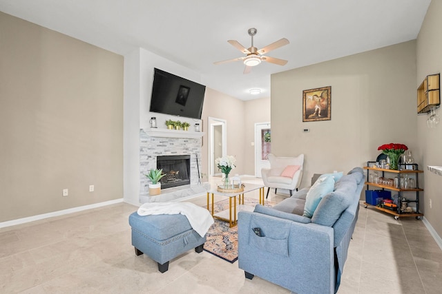 6719 Woodland Oaks, Magnolia, TX 77354 - living room with ceiling fan, a tile fireplace, baseboards, and light tile patterned floors