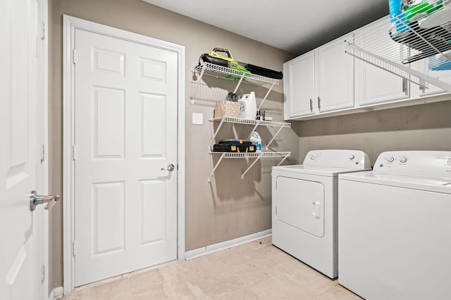 6719 Woodland Oaks, Magnolia, TX 77354 - laundry room featuring washing machine and dryer, cabinet space, and baseboards
