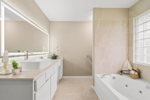 6719 Woodland Oaks, Magnolia, TX 77354 - full bathroom featuring a whirlpool tub, vanity, and baseboards