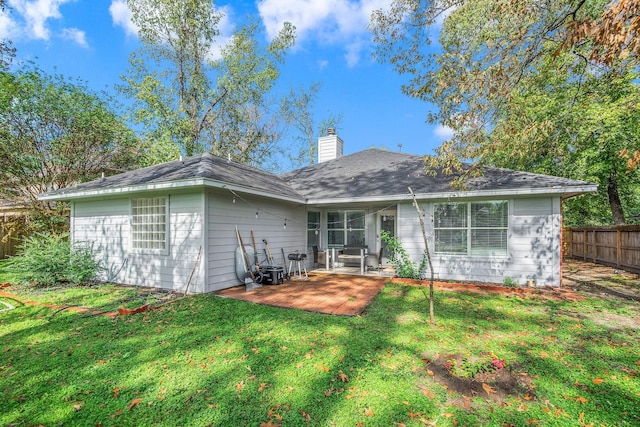 6719 Woodland Oaks, Magnolia, TX 77354 - back of property featuring a patio area and a chimney