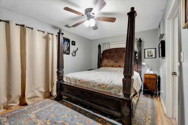7027 Iowa Colony Blvd, Rosharon, TX 77583 - bedroom with light wood-style floors and a ceiling fan