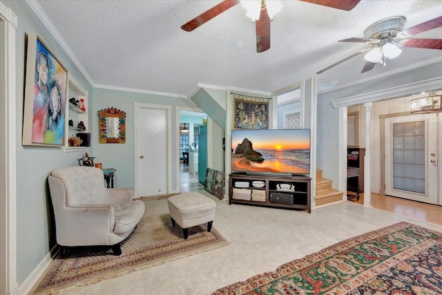 7027 Iowa Colony Blvd, Rosharon, TX 77583 - living room featuring a ceiling fan, ornamental molding, a textured ceiling, stairs, and baseboards