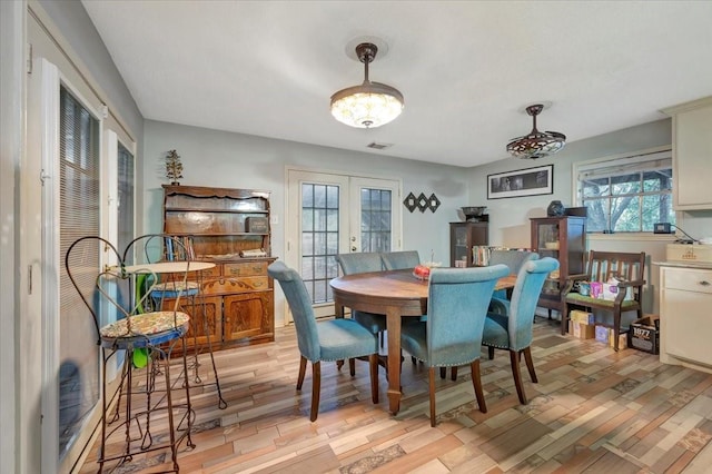 7027 Iowa Colony Blvd, Rosharon, TX 77583 - dining space featuring french doors and light wood-type flooring