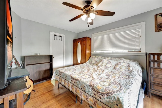 7027 Iowa Colony Blvd, Rosharon, TX 77583 - bedroom featuring wood finished floors and a ceiling fan