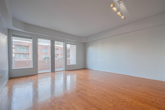 unfurnished room with light wood-style flooring