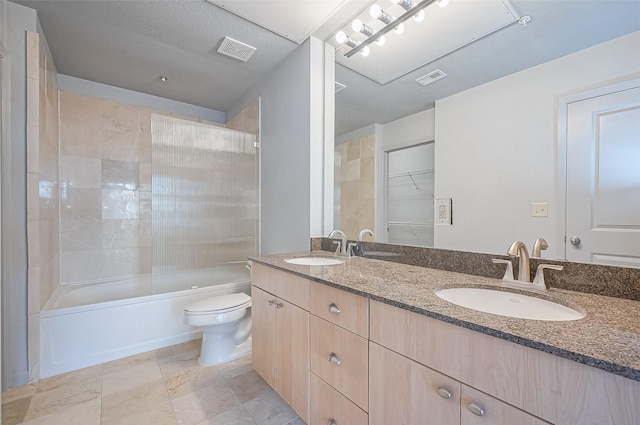 full bath featuring toilet, double vanity, and bathing tub / shower combination