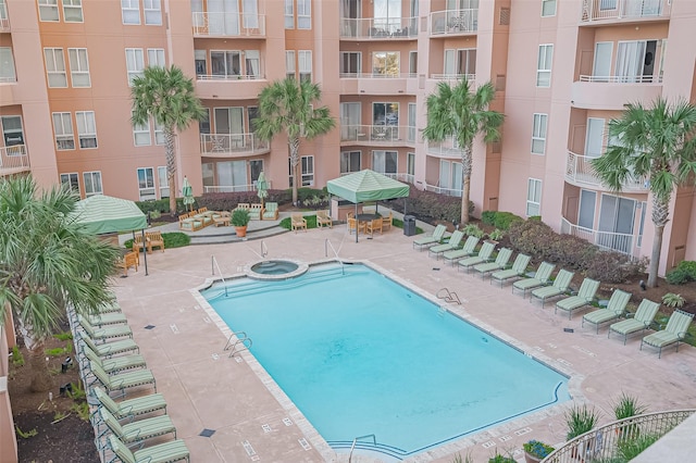 community pool with a patio area