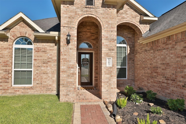 15623 Lavender Bay Ln, Cypress, TX 77429 - property entrance featuring brick siding, a shingled roof, and a yard
