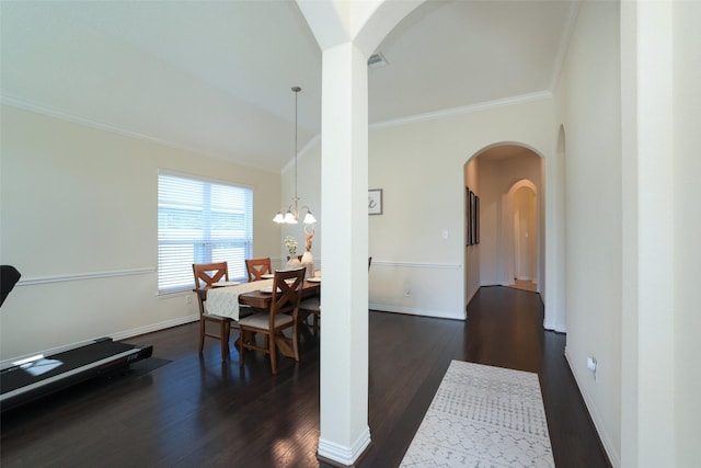 15623 Lavender Bay Ln, Cypress, TX 77429 - dining room with arched walkways, crown molding, dark wood-style floors, baseboards, and a chandelier