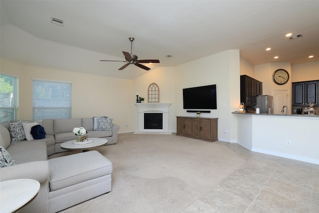 15623 Lavender Bay Ln, Cypress, TX 77429 - living room with recessed lighting, a ceiling fan, lofted ceiling, baseboards, and a fireplace with raised hearth
