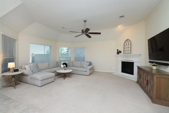 15623 Lavender Bay Ln, Cypress, TX 77429 - living area featuring vaulted ceiling, a fireplace, light colored carpet, a ceiling fan, and baseboards